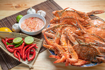 Seafood dish, steamed and cooked blue crab, served with Thai spicy and sour seafood dipping sauce.