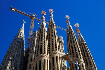 Construction of Sagrada Familia in Barcelona. Cranes above the church.