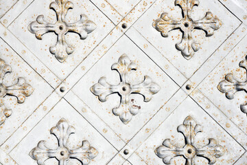 Metal flower ornament. Iron decorative texture. Blacksmith work background. Rusty metal background. Steel corroded flower shape. Blacksmith industry pattern.