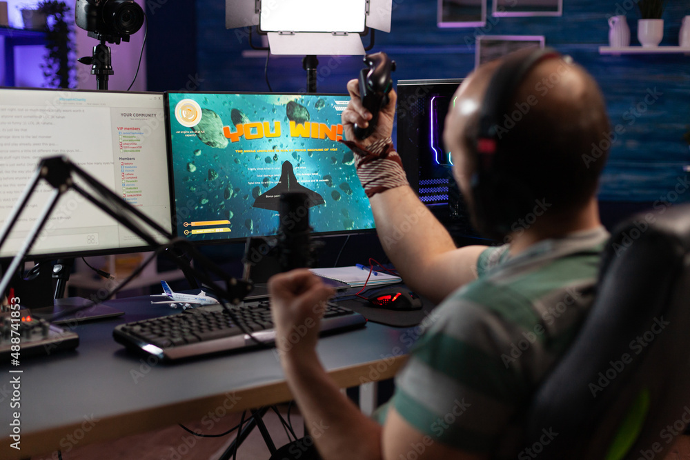 Poster man winning video games and live streaming on computer. adult showing online gameplay on live stream