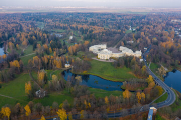 Panoramic aerial view of the Pavlovsk Park and the Pavlovsk Palace on an autumn evening.Bright autumn landscape, Slavyanka river. A suburb of St. Petersburg.