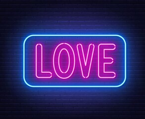 Neon sign Love on brick wall background.