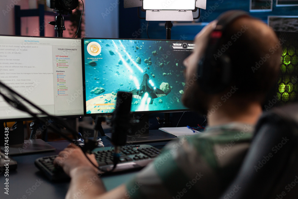 Poster man playing video games on online stream with chat. gamer using microphone and headset on computer, 