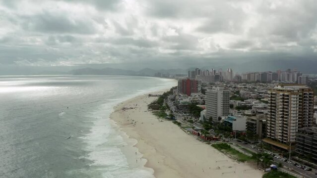 Aerial view Rio de Janeiro Brazil. The waves of the Atlantic Ocean wash the sandy beach in downtown, with houses on the slopes of the mountains.