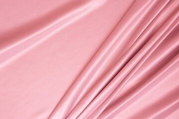 Beautiful elegant wavy light pink satin silk luxury cloth fabric texture with monochrome background design