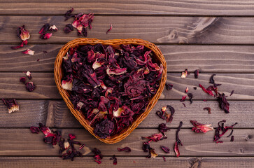 Dried hibiscus petals in a wicker basket