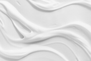 White foam cream texture. Cosmetic cleanser, shower gel, shaving foam background. Creamy cleansing skincare product bubbles.