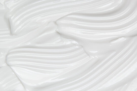 Skincare cream texture. White cosmetic lotion background. Creamy gel, moisturiser, makeup product swatch macro
