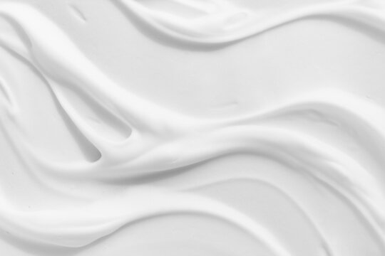 White foam cream texture. Cosmetic cleanser, shower gel, shaving foam background. Creamy cleansing skincare product bubbles.