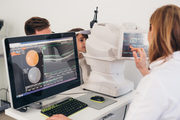child having eye examination.digital retina scan - obrazy, fototapety, plakaty