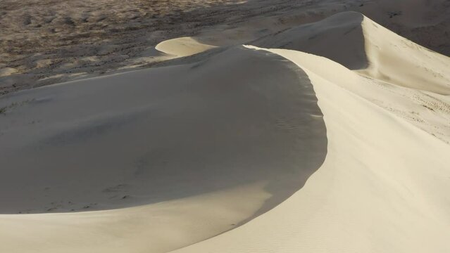 Drone flying over huge sand dunes in Sahara desert, north Africa.