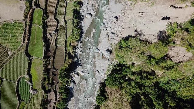 river trails farms farmers rice patties gardens trails on sunny day mountain community in remote are of Kabayan Benguet Philippines Top down birds eye