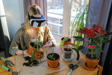 Gardening.Virtual world, metaverse.Girl planting flowers in immersive space VR.Home gardening,digital world.Eco friendly,nature and digital