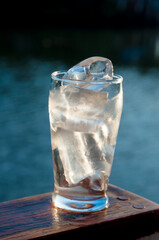 ice in a glass being dissolved by the heat of the air