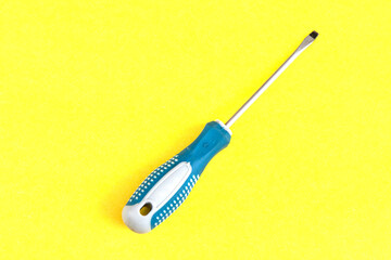 screwdriver detail close up yellow background