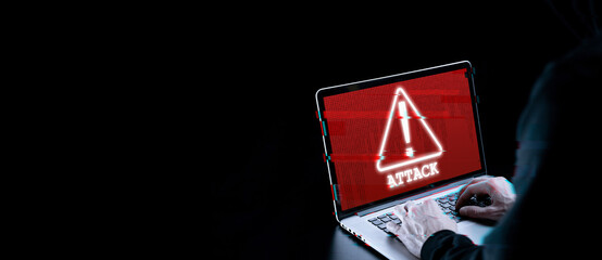 Hacker attack cyber security. Digital laptop in hacker man hand isolated on black. Blurred Internet...