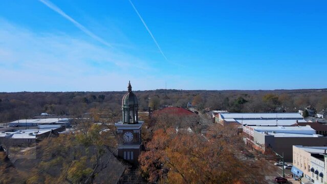 Flying toward and past the clock on the courthouse in downtown Paris Tennessee