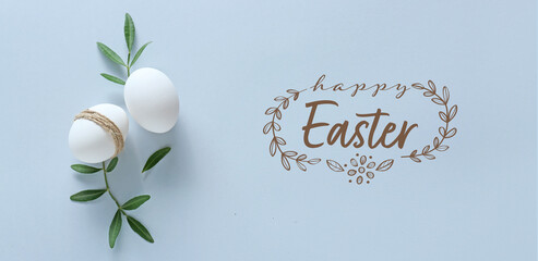 Eggs and text HAPPY EASTER on light background