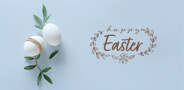 Eggs and text HAPPY EASTER on light background