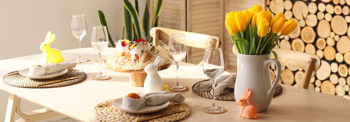 Dining table served for Easter celebration in light room