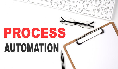 PROCESS AUTOMATION text written on white background with keyboard, paper sheet and pen