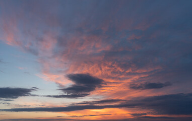 Naklejka na ściany i meble Sunset sky. Summer twilight. Pink clouds. Natural background