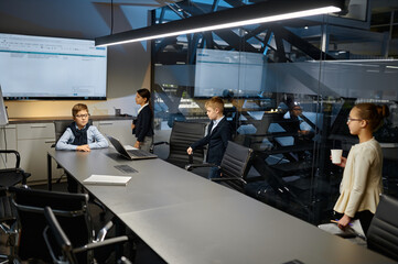 Fototapeta premium Children business team discussion at group briefing