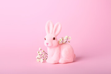 Beautiful Easter bunny and flowers on pink background
