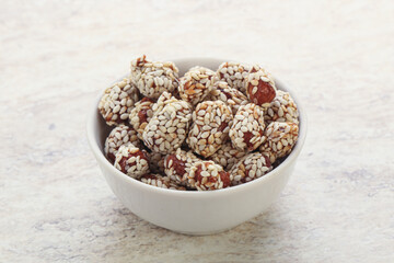 Sweet peanut in sesame seeds