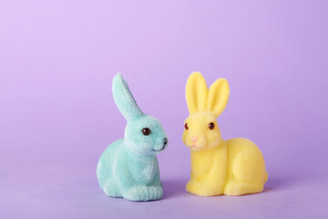 Beautiful Easter bunnies on purple background
