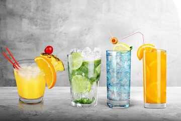 Cocktails drinks. Classic alcoholic long drink with berries, lime, herbs and ice