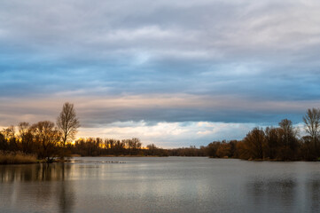 Fototapeta na wymiar Golden sunset mood at the lake