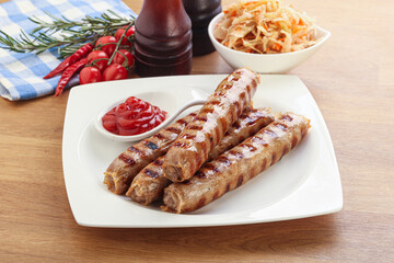 Grilled sausages with cabbage and sauce