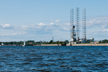 Obraz premium Ensco 101 floating drilling rig,drilling cranes,vessels and mining platforms in Kronstadt on Navy Day.Kronstadt Marine Plant.Russia,Kronstadt,31.07.2021