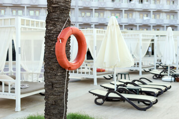 Lifebuoy near the hotel pool. Water safety.