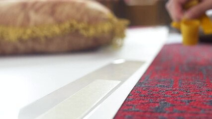 Peeling yellow protection from double sided tape - Powered by Adobe