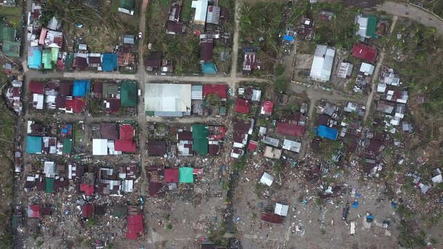 Typhoon Odette (Rai). Destructive Typhoon In The Philippines Left Destroyed Houses And Garbage In A Coastal Village In Southern Leyte. aerial drone top-down
