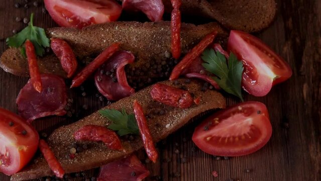 Different varieties of sausages and chips from rye bread, a table for a beer party, relaxation, banner, copy space