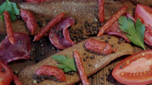 Different varieties of sausages and chips from rye bread, a table for a beer party, relaxation, banner, copy space