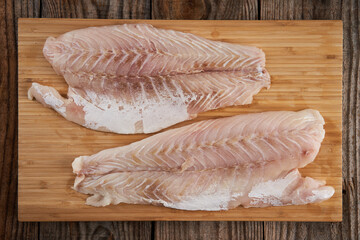 Zander fillets on a wooden board