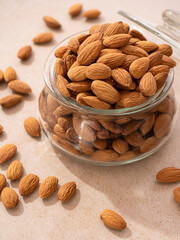 Dry nuts in glass jars, on white background. Food storage. Glass Containers. Kitchen need.