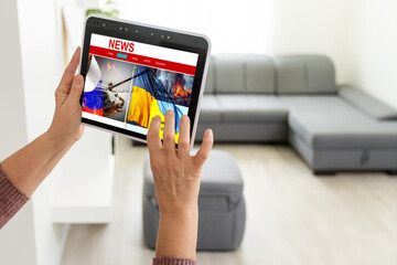 young journalist with tablet news, flag of russia and ukraine