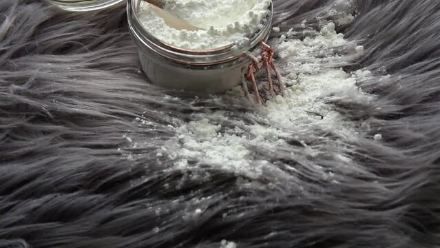 Pouring Corn Starch Cornflour Powder On Long Hair Fur Carpet For Cleaning And Stain Removal. Natural Home Cleaners Concept.