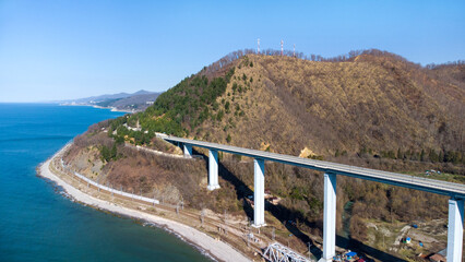 Zubova Schel viaduct. The highest bridge in Russia. Beautiful aerial panorama of a road bridge over a mountain gorge overlooking the sea. Sochi, Russia. 