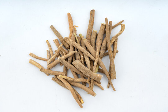 Ashwagandha, Withania Somnifera Root Closeup  over isolated background Top view