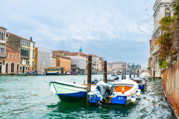Obraz premium Two motorboats docked at Grand Canal in Venice.