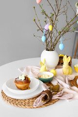 Plate with delicious bun on table served for Easter celebration