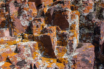 Closeup of rock surface. Textured rough dark surface. Rock wall background.