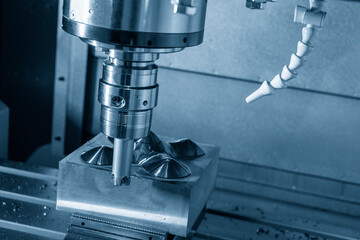 The CNC milling machine rough cutting the injection mold parts by indexable  endmill tools.