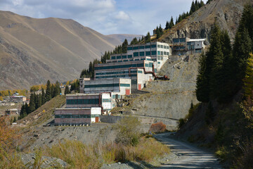 old abandoned building in mountains with trees in autumn in central asia kyrgyzstan USSR...